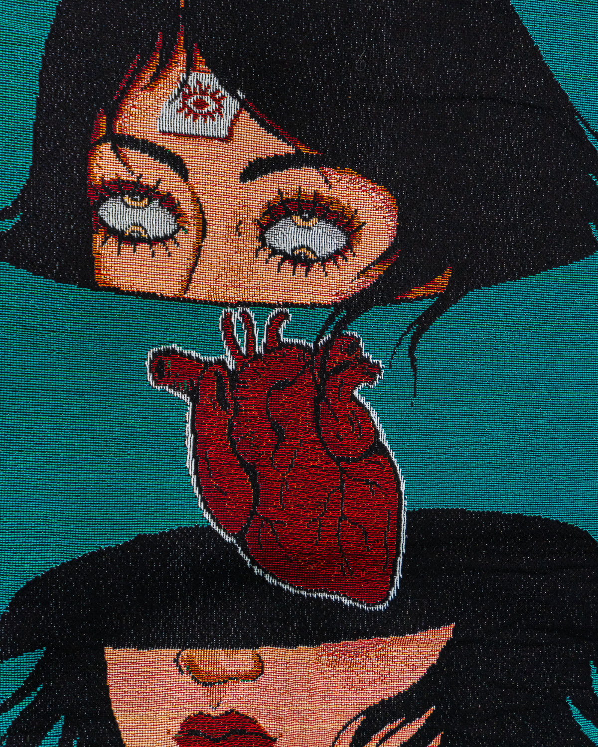 Embroidered design of a woman with a heart on her chest against a teal background